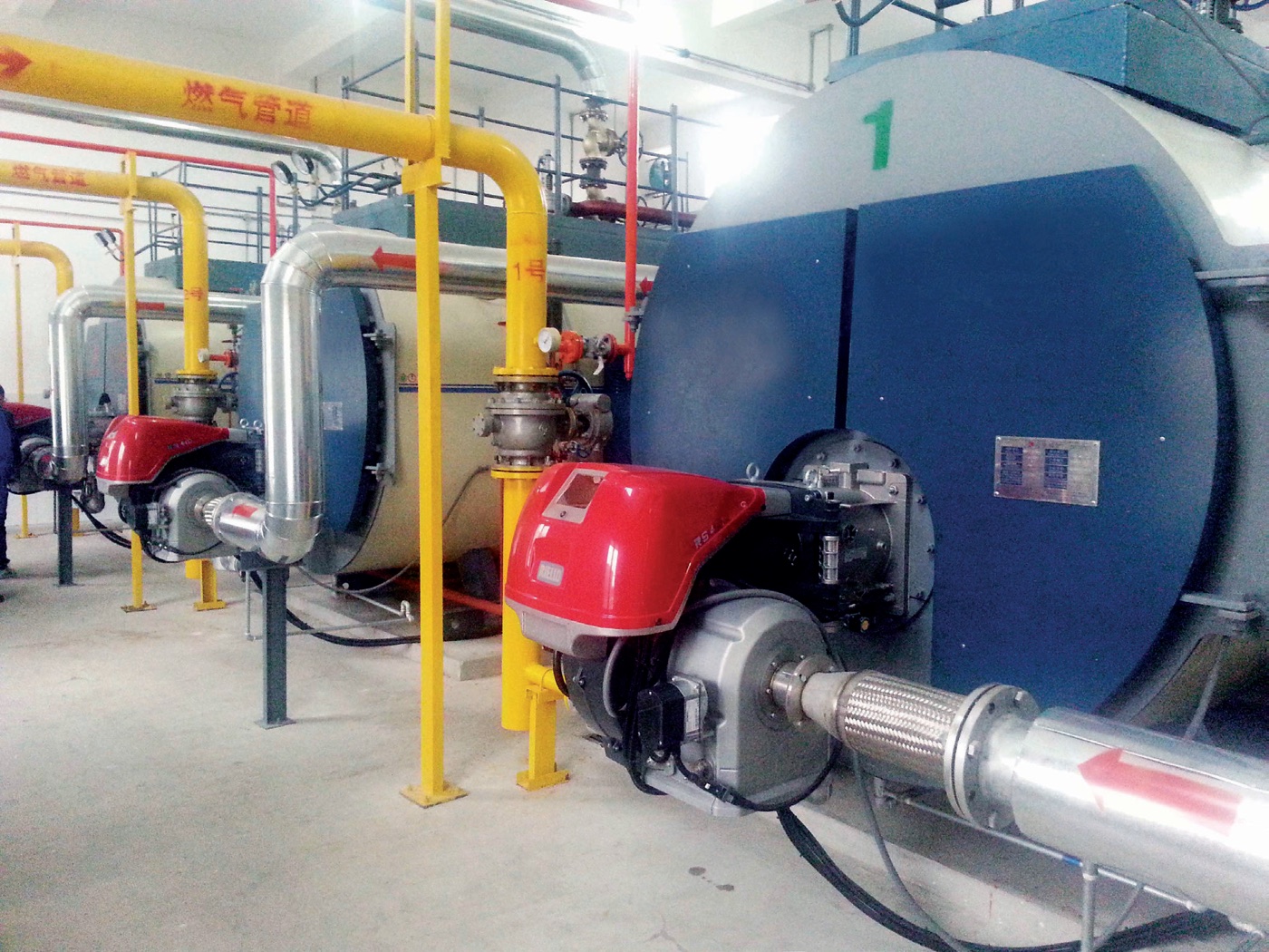 Gas steam boiler room at a food processing plant after combustion retrofit
